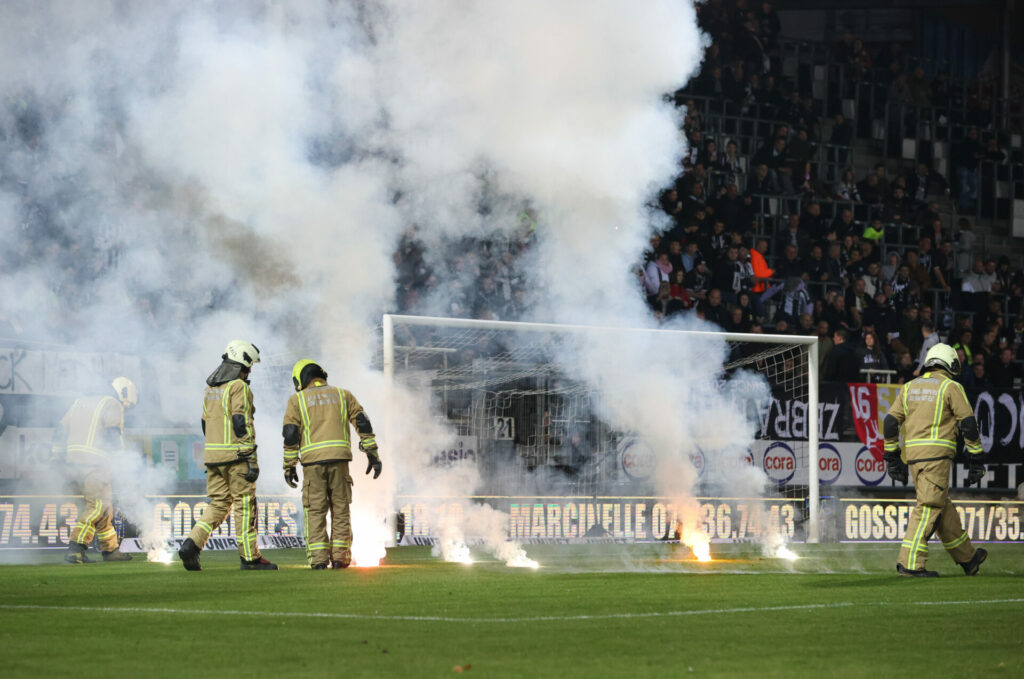 Car and football supporters' building hit by fire